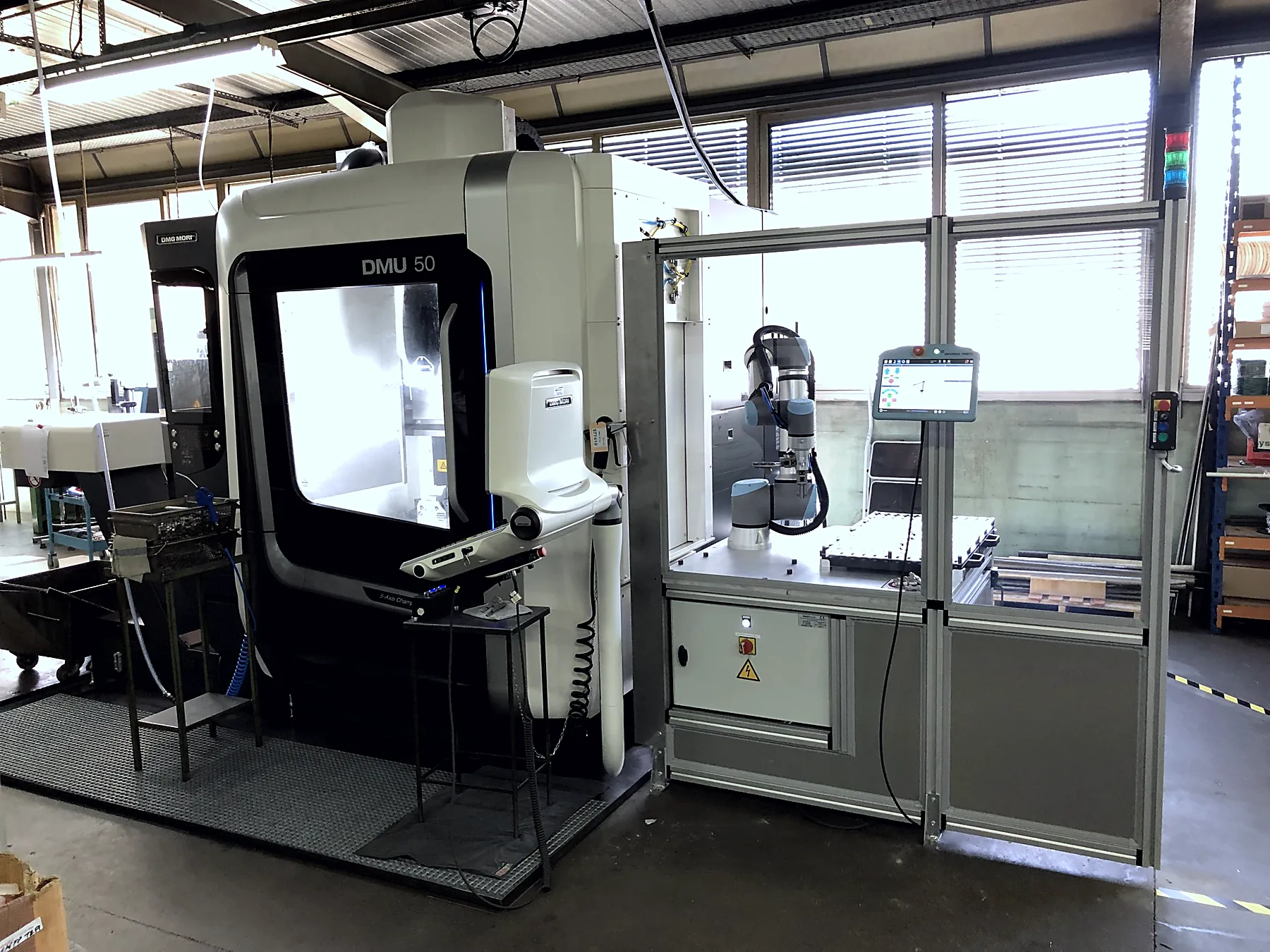 Cellule cobotisée de chargement de machines-outils