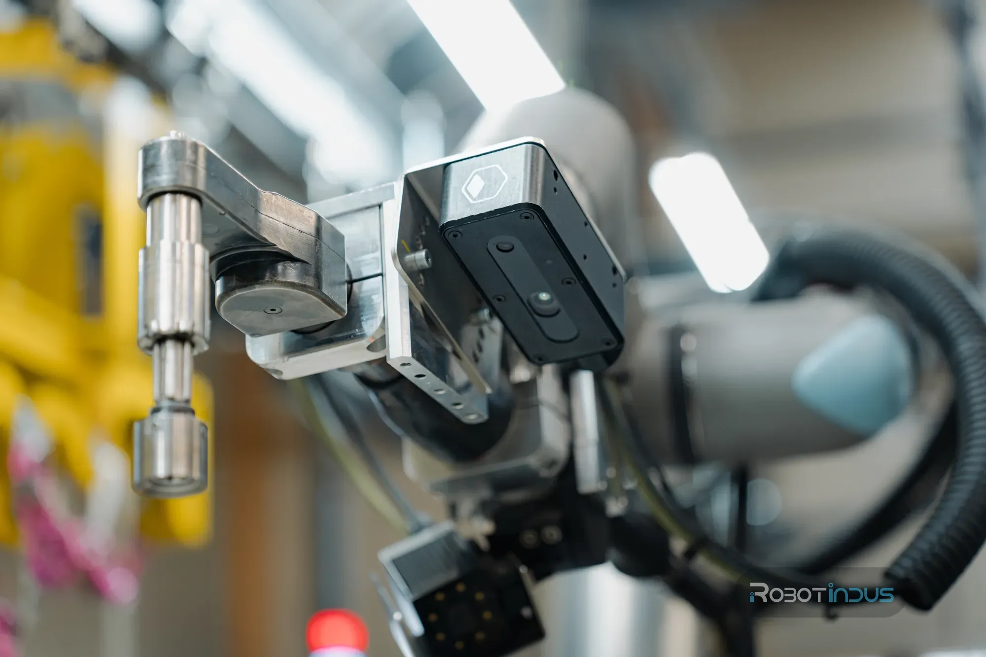 Outil de vissage et caméra 3D montés sur un cobot